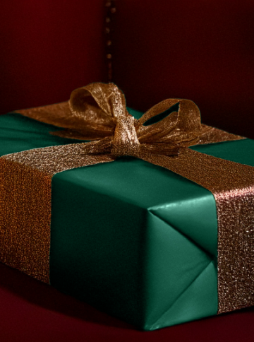 Green present with gold bow