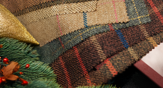 Tweed fabric swatches nestled in christmas decor